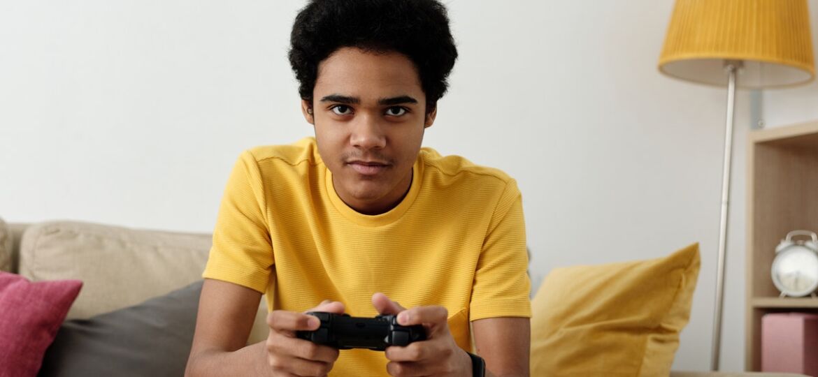 teenager playing video games